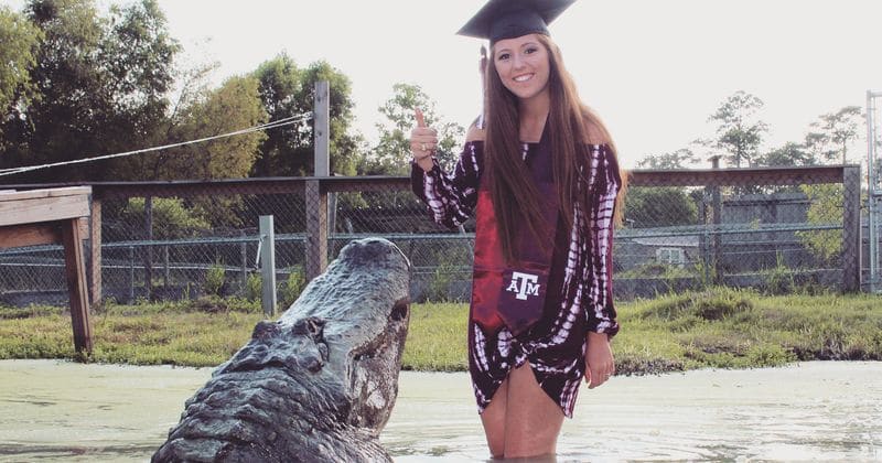 Student who posed with giant alligator for graduation photos says 'he's like a puppy'