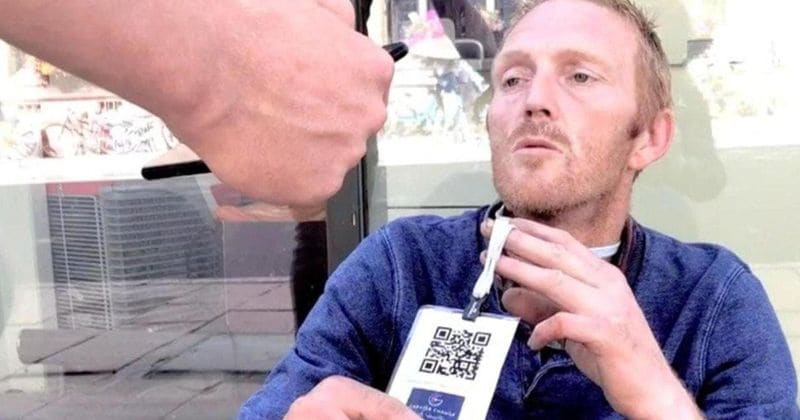 Homeless people are now wearing barcodes to promote cashless donations