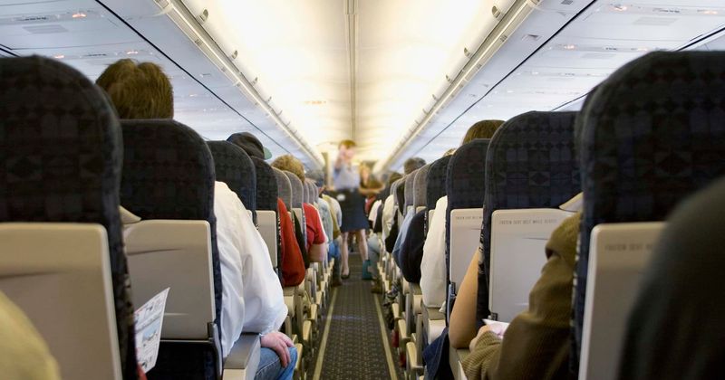 Passenger left wearing only a bra after being restrained by cabin crew for 'causing havoc' on flight