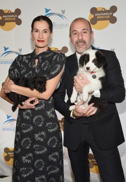 Annette Roque (L) and television journalist Matt Lauer pose for a picture with a dog at the 2013 Animal League America Celebrity gala at The Waldorf Astoria on November 22, 2013 in New York City. (Photo by Mike Coppola/Getty Images)