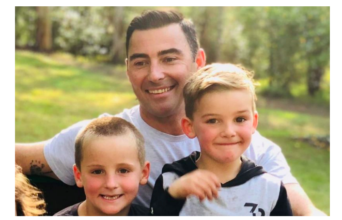 Brad pictured with his children in this image. (GoFundMe)