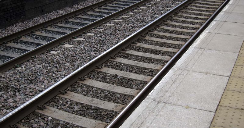 Shocking footage shows teenage boy trying to throw his girlfriend in front of a train