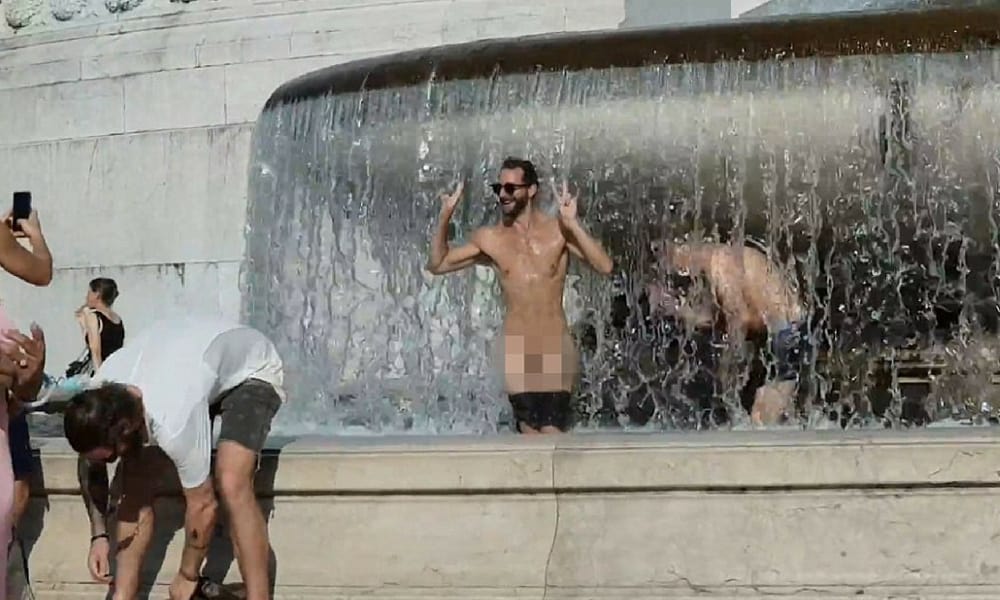 One of the young men pulled down his underpants to reveal his genitals, in a scene that was captured on video by a passerby (YouTube)