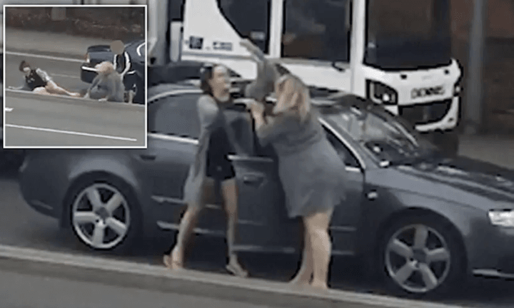 Two mothers were recorded on camera slapping and choking one another after a road rage row escalated in Northampton on Tuesday afternoon. (YouTube)