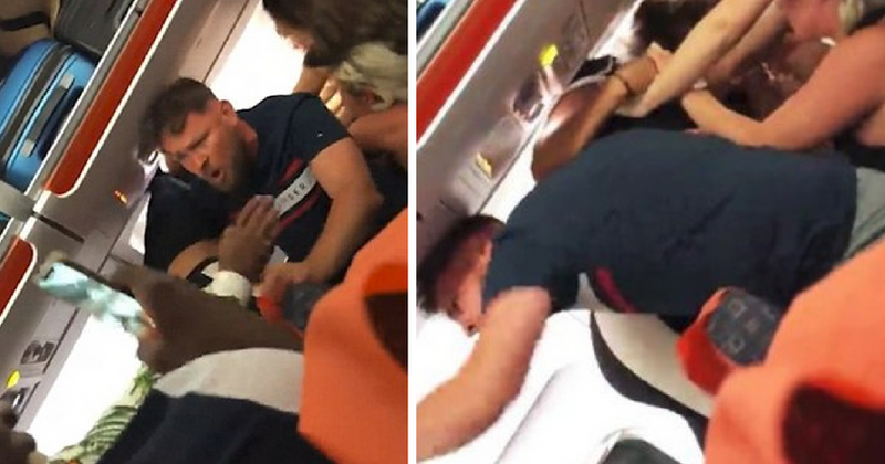 VIDEO: Mass brawl erupts on flight after drunk woman allegedly gave passengers 'lap dances' and 'flashed her boobs'