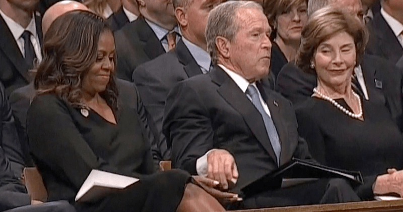 George W Bush playfully sneaks candy to Michelle Obama during John McCain's memorial service
