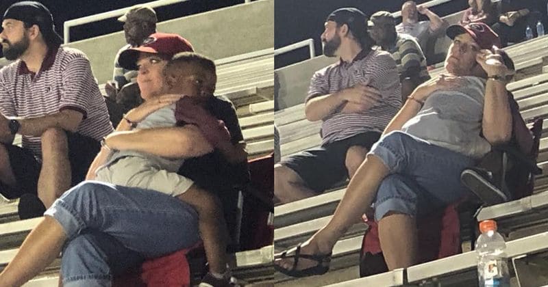 'She rocked him to sleep like she had given birth to him': Heartwarming photos show stranger comforting little boy at football game