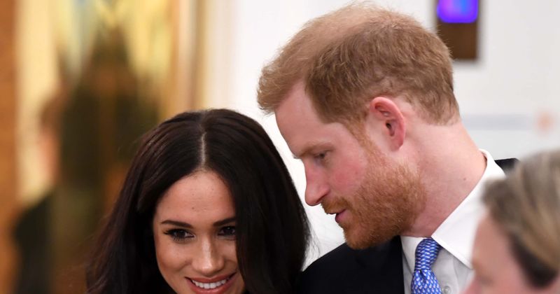 Cheeky Prince Harry caught sneaking snacks behind his back while Meghan Markle promotes her charity cookbook