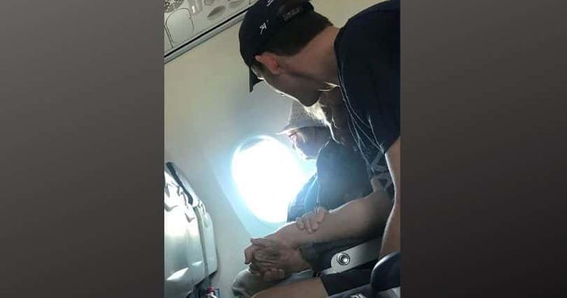 Young man comforts 96-year-old on her first flight in 15 years, seen hugging her during turbulence