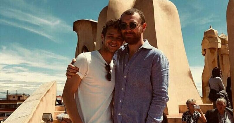 Sam Smith says he's 'still quite raw' about his breakup with Brandon Flynn