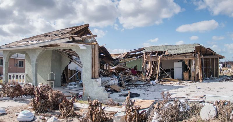 Father who put 5-year-old son on roof to escape sharks helplessly watches as Hurricane Dorian winds sweep away his little boy