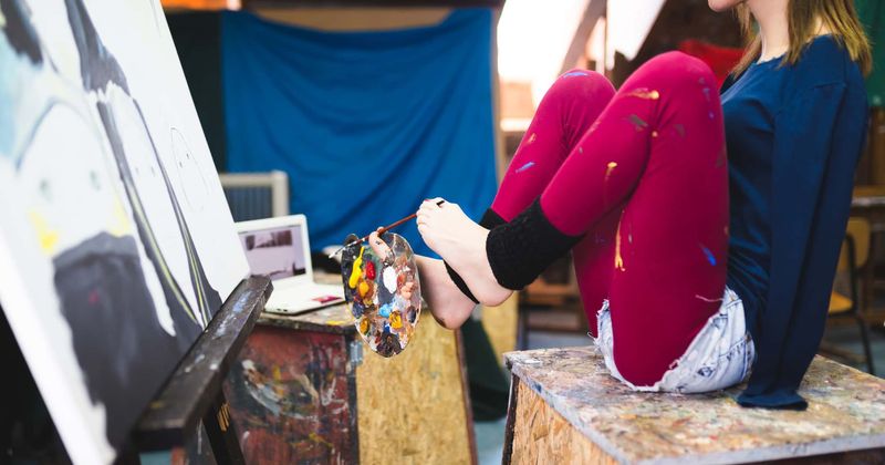 Artists who paint with their feet have 'toe maps' in their brains that can be used to develop advanced prosthetic limbs