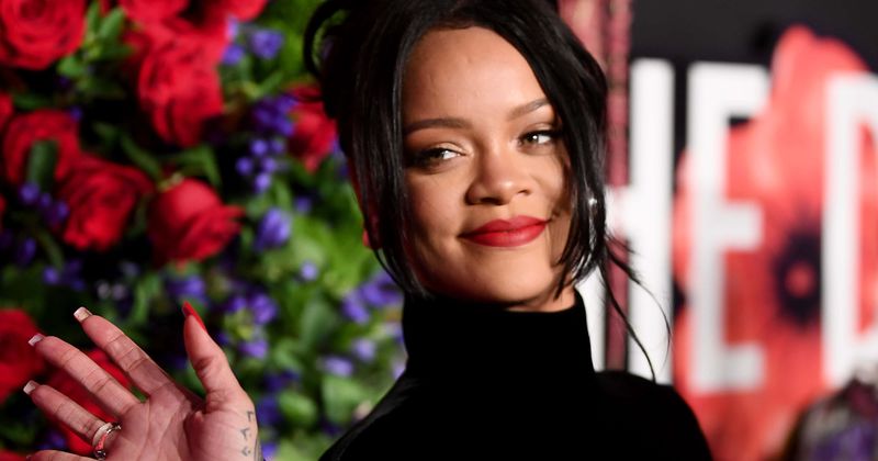 Rihanna oozes 50s glam in mermaid-shaped Givenchy gown with a high neck as she raises money for Dorian victims