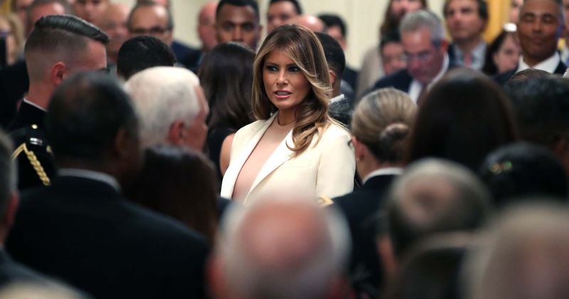 Melania Trump stuns in white Dior pantsuit as she joins president at Medal of Freedom ceremony, week after 9/11 dress fiasco