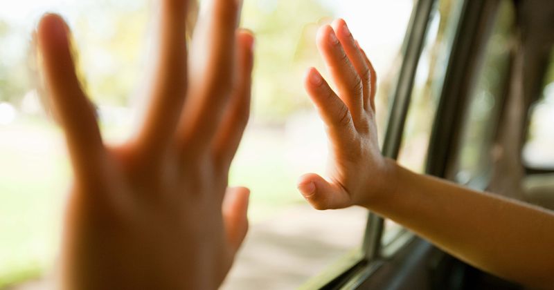 2-year-old girl dies after getting her head stuck in car's power window while trying to climb out as father slept in front seat