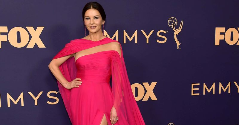 Catherine Zeta-Jones flaunts flawless figure in black plum dress alongside husband Michael Douglas at BAFTA LA Tea Party