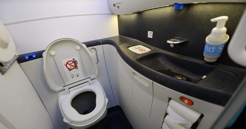 United Airlines flight makes 'emergency landing' after passenger gets trapped in bathroom halfway through the journey