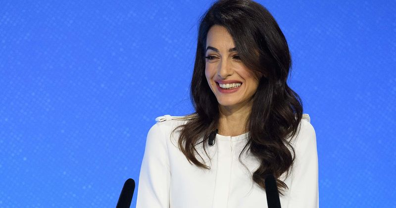 Amal Clooney shows off toned legs in chic miniskirt as she steps out with George Clooney to celebrate fifth wedding anniversary