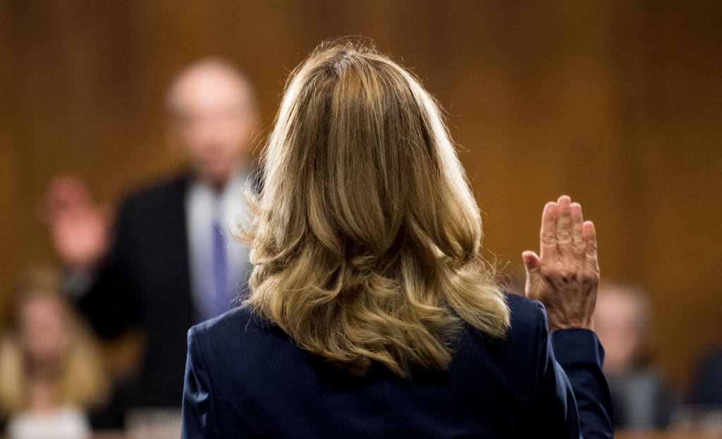 Christine Blasey Ford is sworn in by chairman Chuck Grassley, R-Iowa, on Capitol Hill September 27, 2018 in Washington, DC. (Photo By Tom Williams-Pool/Getty Images)