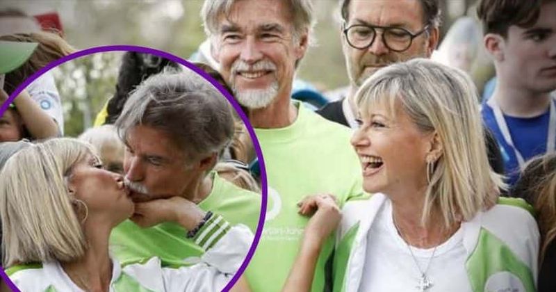 Olivia Newton-John shares loving kiss with husband as she's joined by family for cancer walk in Melbourne