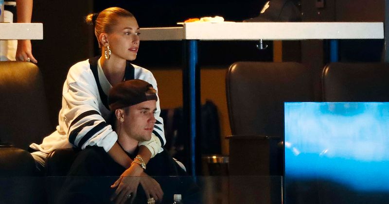 Justin Bieber rips off Hailey Baldwin's garter with his teeth in new photos from wedding ceremony