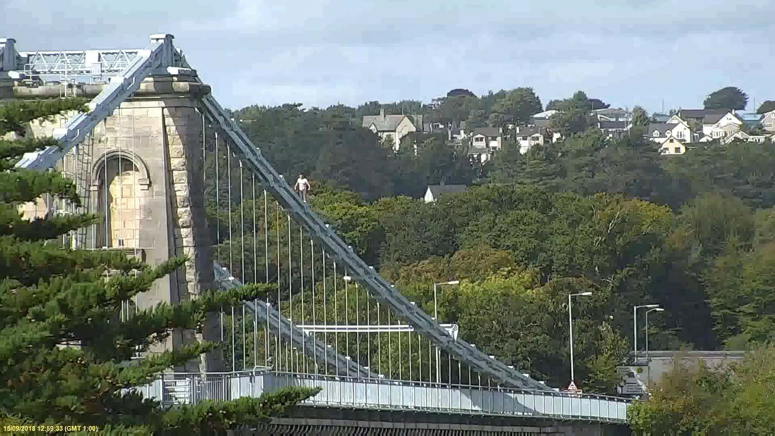 Paramedics, firefighters, coastguards and an RNLI lifeboat supported the police in trying to get Jones down from the bridge safely (SWNS)