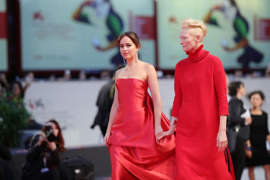 Dakota Johnson and Tilda Swinton walk the red carpet ahead of the 'Suspiria' screening during the 75th Venice Film Festival at Sala Grande on September 1, 2018, in Venice, Italy. (Getty Images)