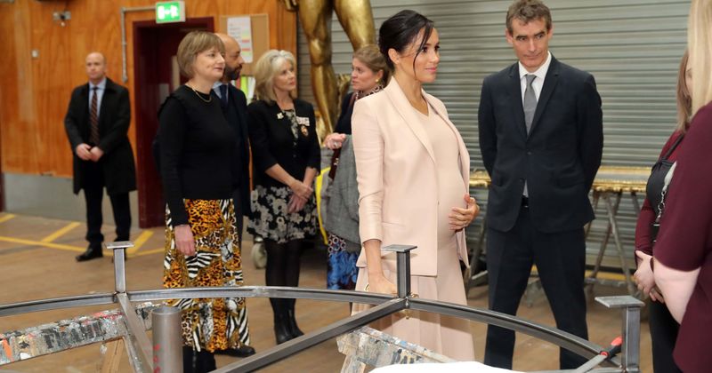 Prince Harry snaps gorgeous picture of Meghan Markle cradling her baby bump