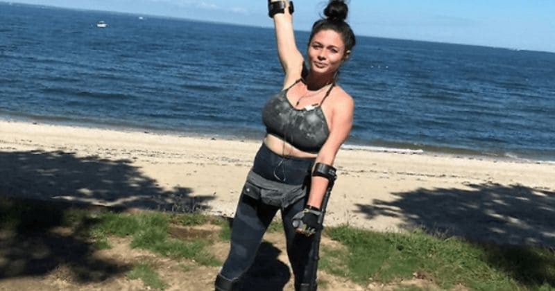 Woman who fell off cliff while escaping sexual assault two years ago finishes marathon on crutches