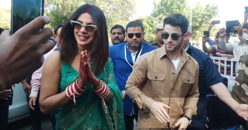 Newlyweds Nick Jonas and Priyanka Chopra seen walking hand-in-hand as they head to Delhi for wedding reception