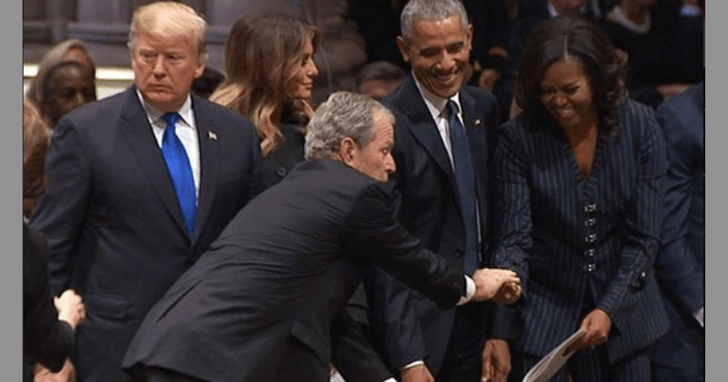 George W Bush slips Michelle Obama a mint during his father's funeral mirroring the famous candy exchange at McCain's funeral