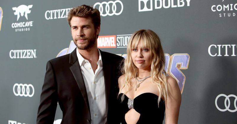 Miley Cyrus and Liam Hemsworth waste no time in making up for 3 years apart as they cozy up on SNL