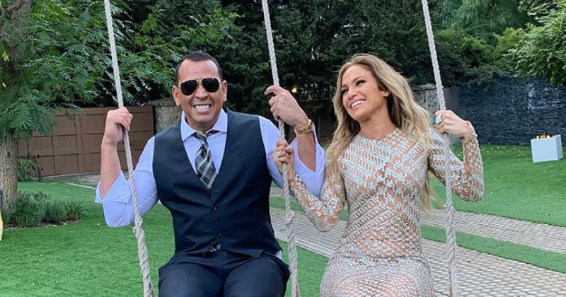 Jennifer Lopez rocks a sheer dress as she shares a swing with Alex Rodriguez