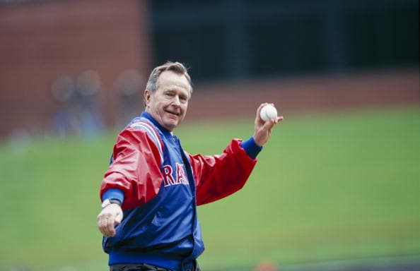 George H.W. Bush throws out the first pitch before the Texas Rangers Opening Day game against the Chicago White Sox at The Ballpark in Arlington on April 3, 2000, in Arlington, Texas (Getty Images)