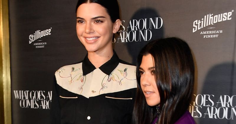 Kourtney Kardashian follows in younger sister Kendall Jenner's footsteps and poses in similar bikini in snowing weather