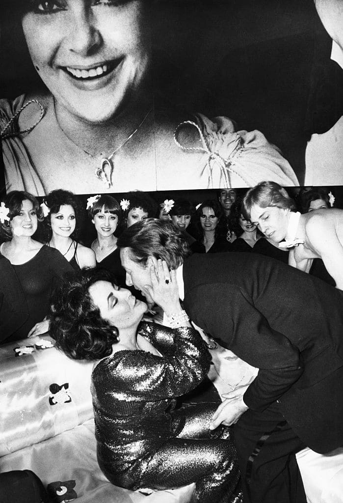 Elizabth Taylor with fashion designer Halston at a belated 46th birthday party for her at Studio 54 (Getty Images)