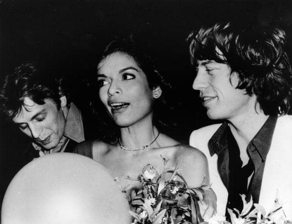 Dancer Mikhail Baryshnikov, Bianca Jagger, and her husband the singer Mick Jagger, party at Studio 54 for Bianca's birthday, May 1977. (Photo by Rose Hartman/Getty Images)