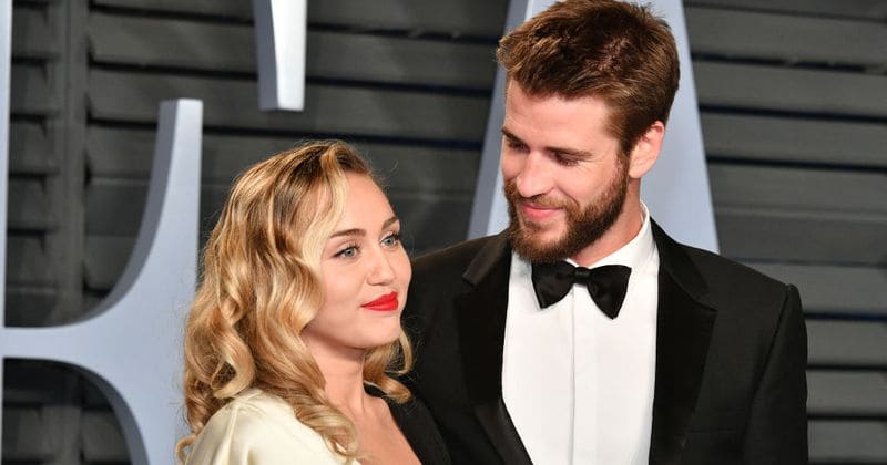 Liam Hemsworth tears up as he reveals Miley Cyrus has taken his surname: 'I didn't ask her to'