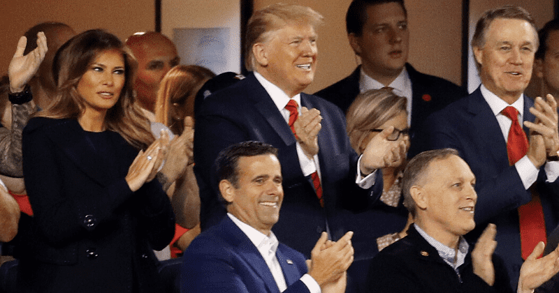 Melania looks visibly uncomfortable as crowd boos Donald Trump and chants 'lock him up' at World Series