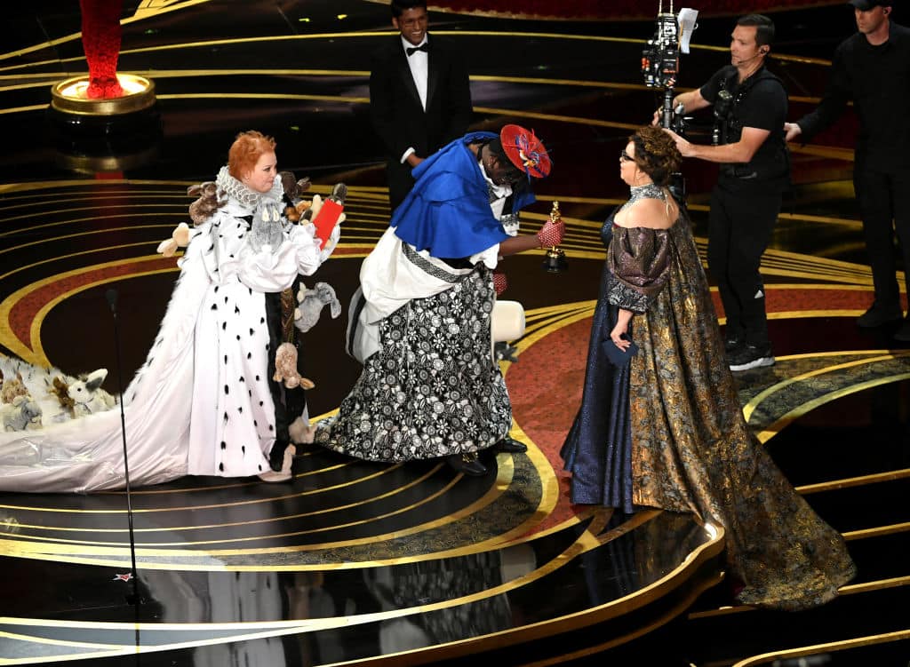 (L-R) Melissa McCarthy and Brian Tyree Henry present the Costume Design award for 'Black Panther' to Ruth E. Carter onstage during the 91st Annual Academy Awards at Dolby Theatre on February 24, 2019 in Hollywood, California. (Photo by Kevin Winter/Getty Images)