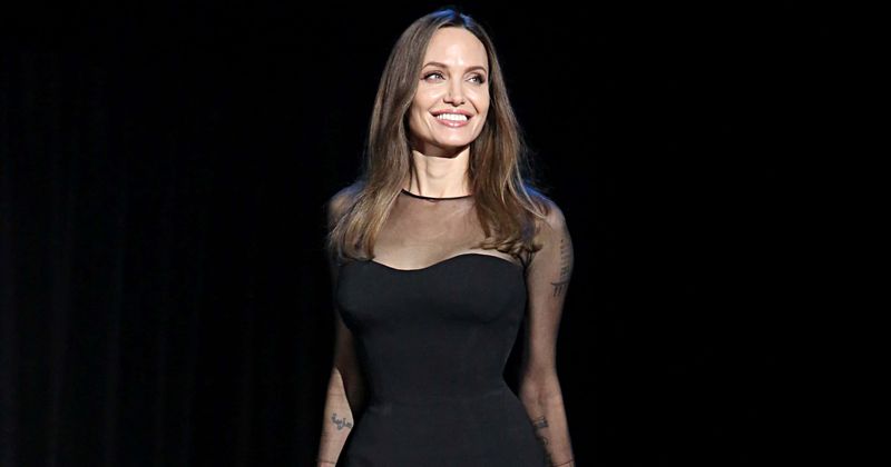 Angelina Jolie poses nude for photoshoot, says she wants to live overseas but Brad Pitt won't let her until children turn 18