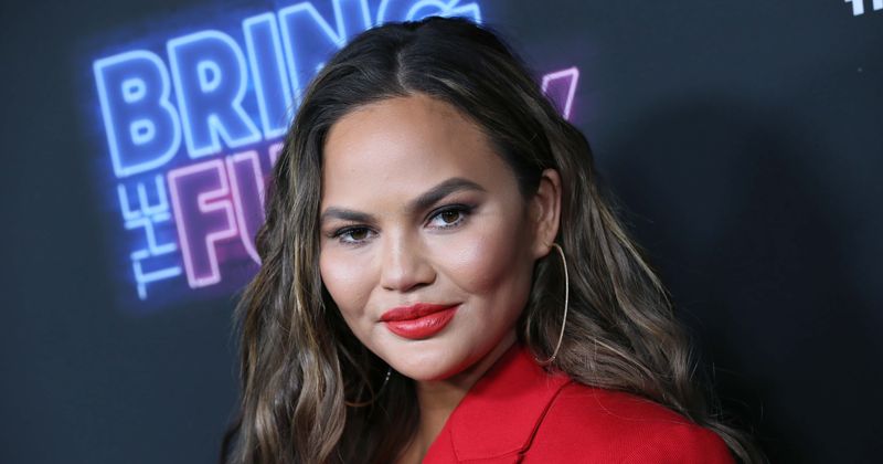 Chrissy Teigen vows not to be 'such an a**hole' after fans slam her for 'tone-deaf' tweet about mom's spending habits