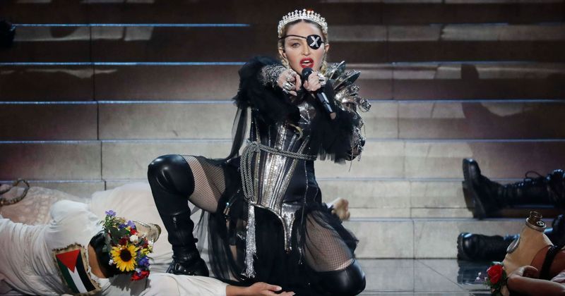 Madonna says 'it's good to drink urine' while holding a cup of yellow liquid after taking a dip in ice-cold water following Madame X show