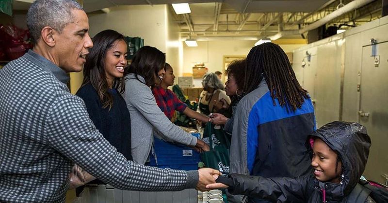 Malia Obama looks gorgeous and all grown-up as she hands out Thanksgiving meals with her family