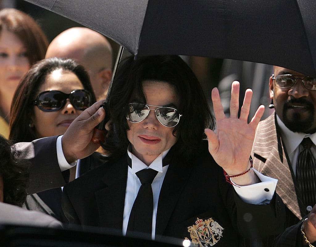 Michael Jackson waves to fans after he is found not guilty on all counts in his child molestation trial at the Santa Barbara County Courthouse June 13, 2005 in Santa Maria, California. Jackson was charged in a 10-count indictment with molesting a boy, plying him with liquor and conspiring to commit child abduction, false imprisonment and extortion. (Photo by Win McNamee/Getty Images)