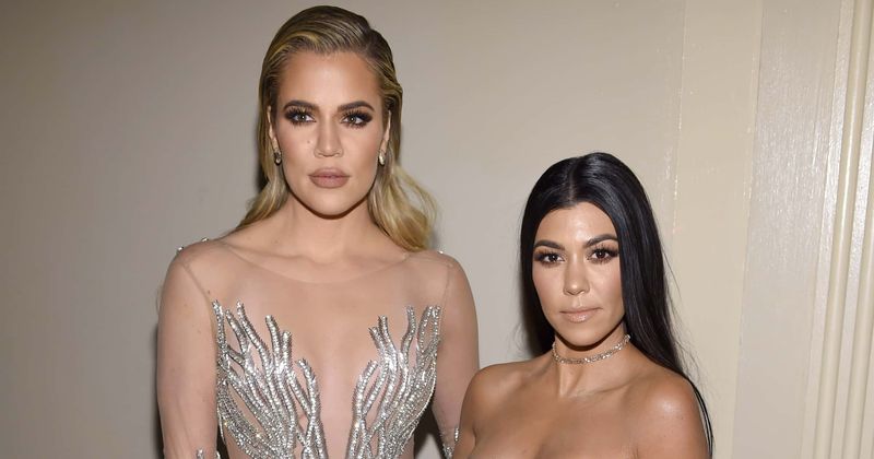 Khloe and Kourtney Kardashian stun in revealing ensembles for girls' night out with siblings Kylie and Kim