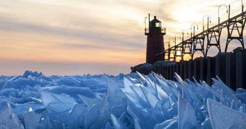 Frozen Lake Michigan looks stunning as blue shards of ice cover its surface as it begins to thaw