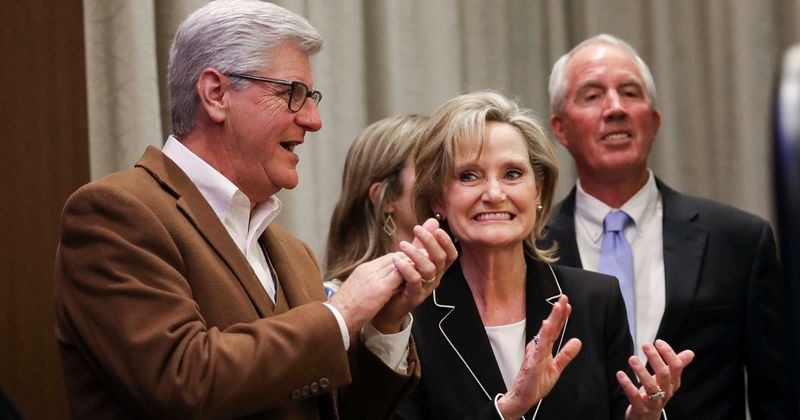 Mississippi governor bans abortions at about six weeks if 'heartbeat' can be heard
