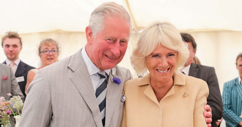 Prince Charles and Camilla enjoy romantic stroll on white sands of beautiful Grenada beach