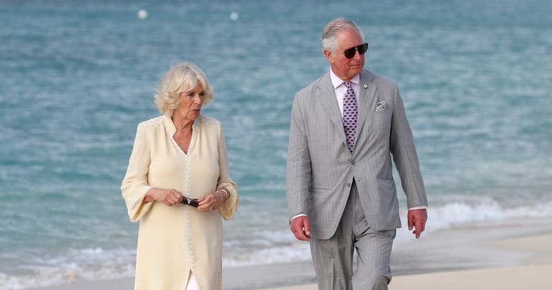 Prince Charles and Camilla enjoy romantic stroll on white sands of beautiful Grenada beach